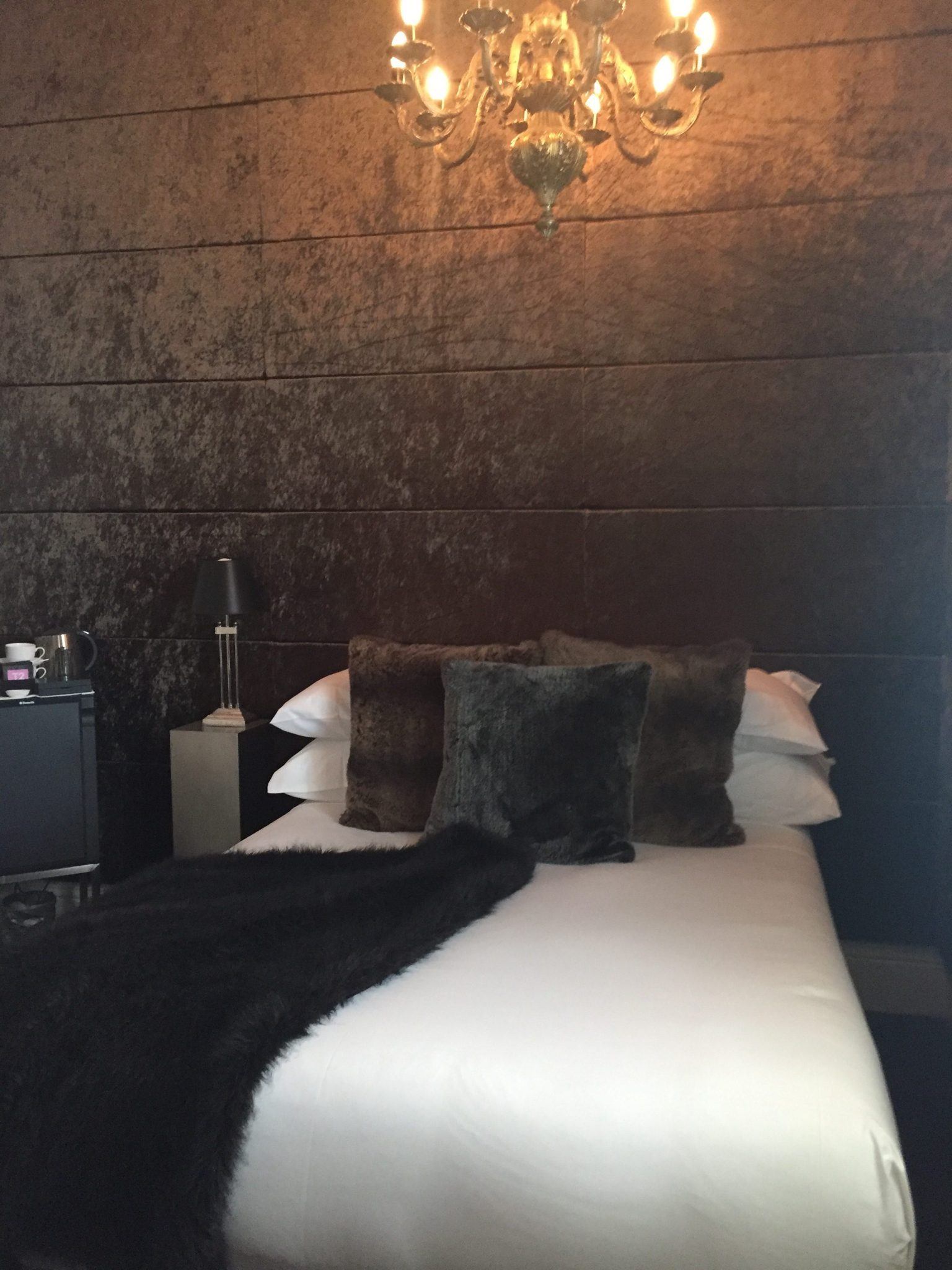 bedroom at hotel frangos daylesford spa with furry pillows