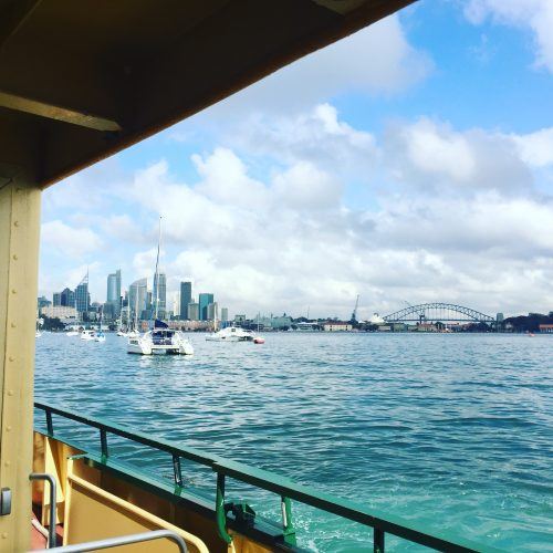 view of the sydney skyline and the harbour bridge from a sydney ferry view of the sydney skyline and the harbour bridge from a sydney ferry