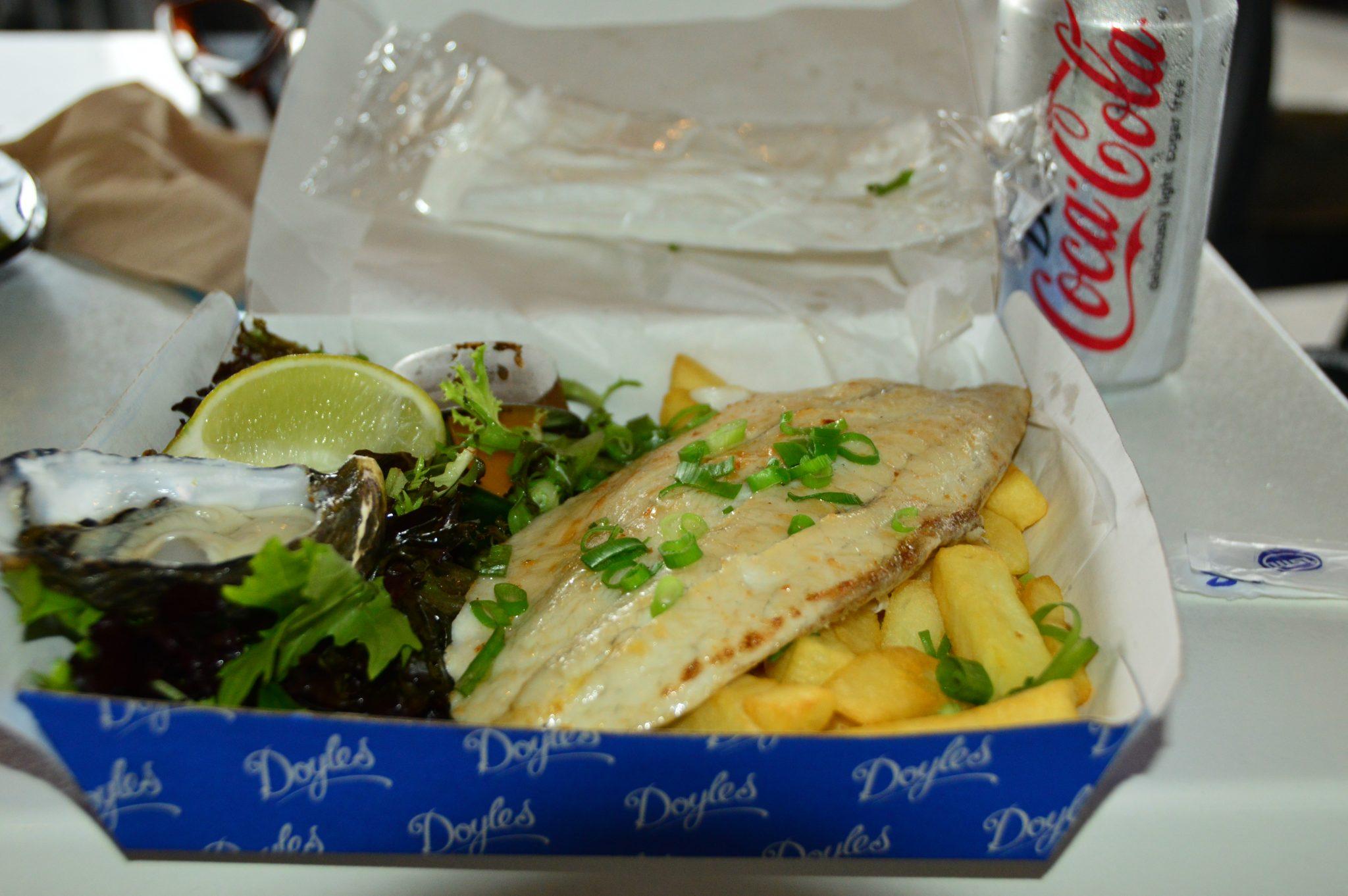 barramundi oysters and chips in a box with a diet coke doyles watsons bay sydney