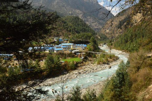 river and houses heading into phakding nepal river and houses heading into phakding nepal