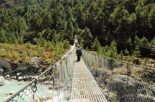 suspension bridge with trees in background everest base camp trek nepal suspension bridge with trees in background everest base camp trek nepal