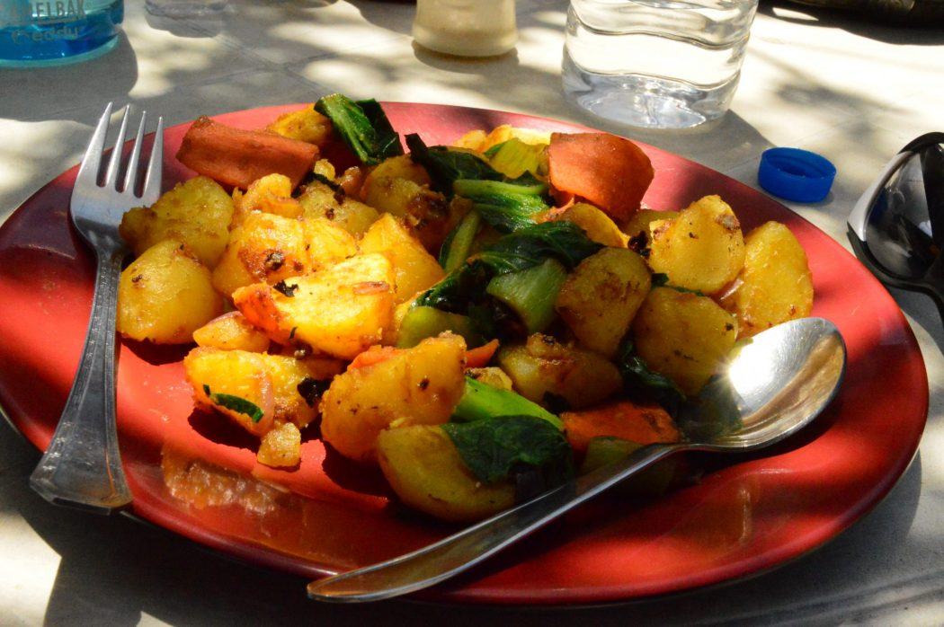 Nepal Tea House: What to Expect on the Everest Base Camp Trek 15 plate of potatoes with some grilled vegetables and cutlery