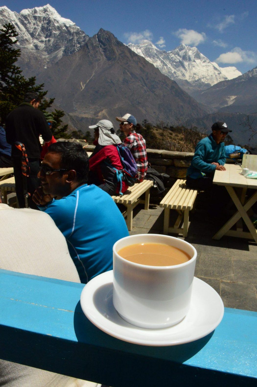 cup of coffee on terrace with mount everest behind