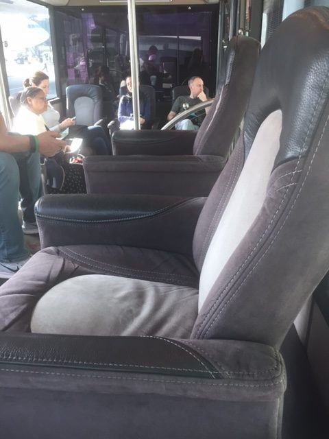 plush seats on the business class bus for qatar at doha airport