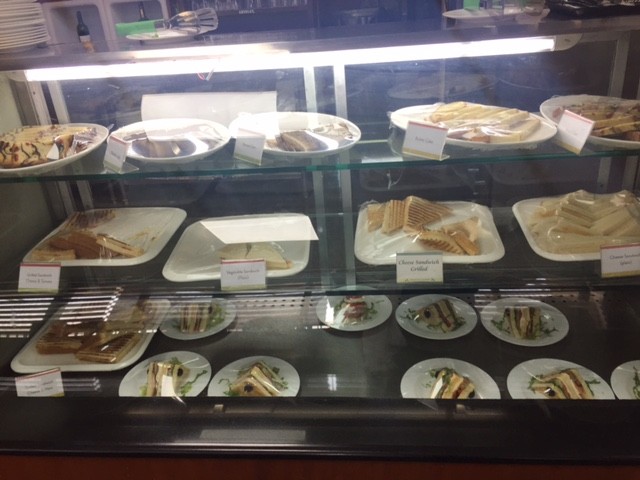 sandwiches in a clear unit in the business class lounge at kathmandu airport