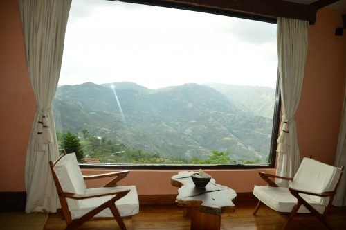chairs and window with a view of the kathmandu valley at dwarika's resort dhulikhel