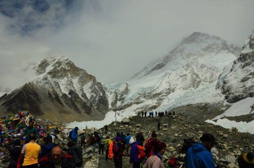 everest base camp with trekkers and mountains in background everest base camp with trekkers and mountains in background