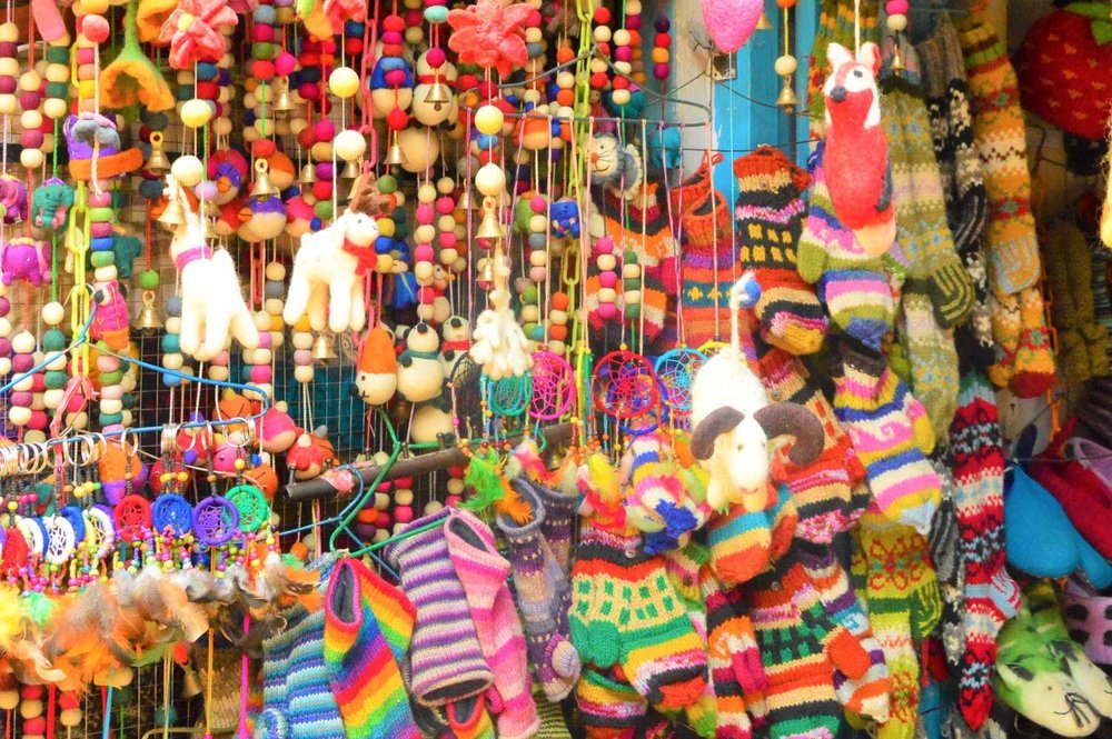 9 Best Places to Visit in Kathmandu & Nearby 8 colourful necklaces and socks on display in a kathmandu shop