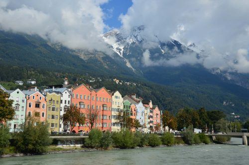 colourful houses on the water with a mountain behind innsbruck highlights colourful houses on the water with a mountain behind innsbruck highlights