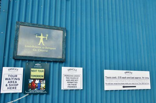signs on the blue exterior of the dingle distillery ireland signs on the blue exterior of the dingle distillery ireland