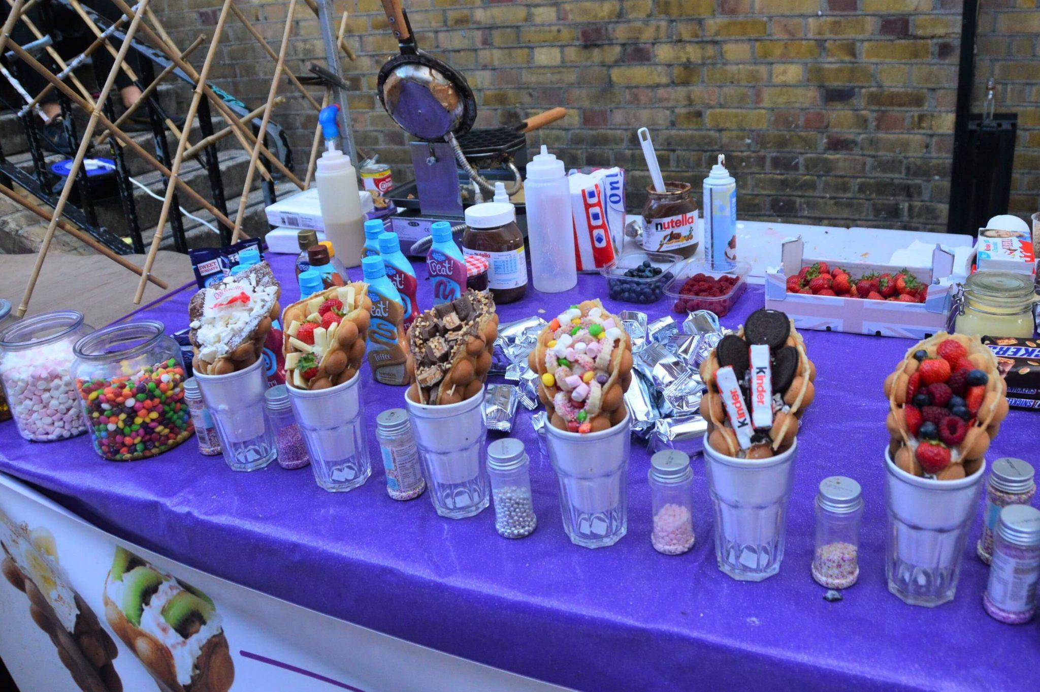 4 Great Victoria Station Restaurants 26 waffles with colourful ingredients on a purple tablecloth at the truman brewery
