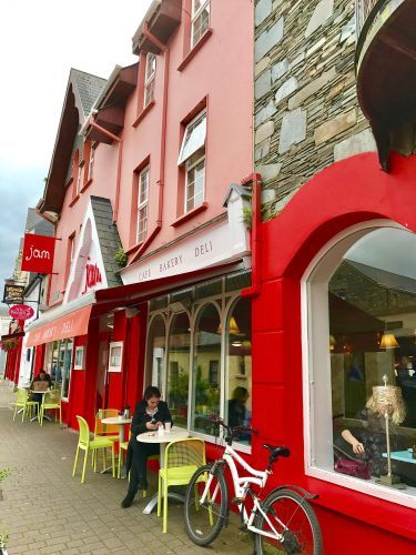 red buildings and outdoor seats on a street in killarney ireland red buildings and outdoor seats on a street in killarney ireland