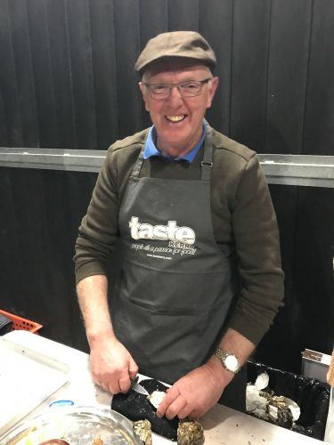 older man shucking oysters killarney ireland older man shucking oysters killarney ireland
