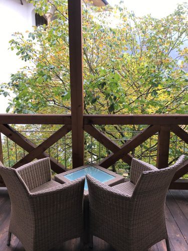 rattan chairs with table on terrace at Arosa Kitzbühel rattan chairs with table on terrace at Arosa Kitzbühel