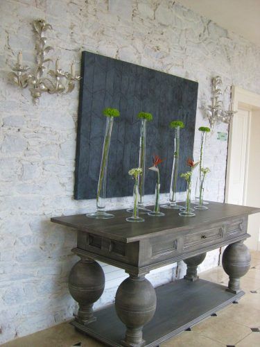 wooden side board with tall vases and flowers monart spa ireland wooden side board with tall vases and flowers monart spa ireland