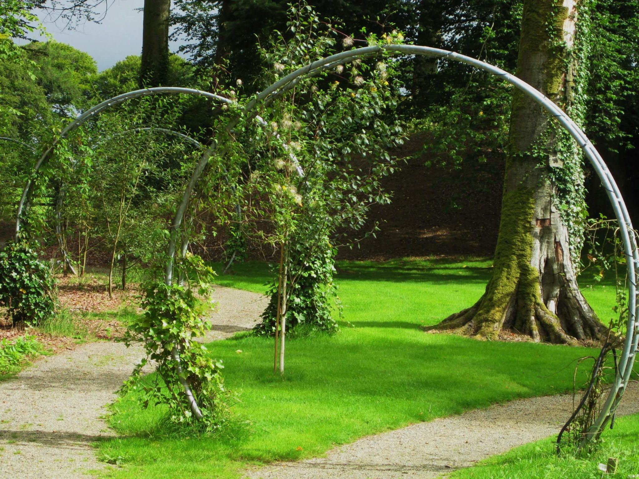arch shaped sculptures with greenery in gardens at monart spa ireland