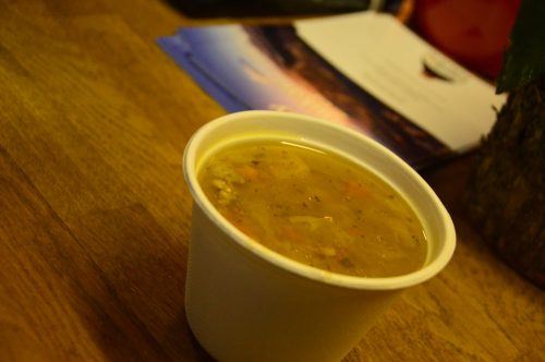 bowl of lamb soup on a wooden table iceland