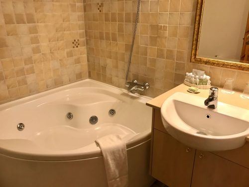 bath and sink in bathroom at hotel ranga iceland