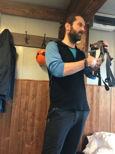 Man displaying how the harness works for Inside the Volcano Iceland