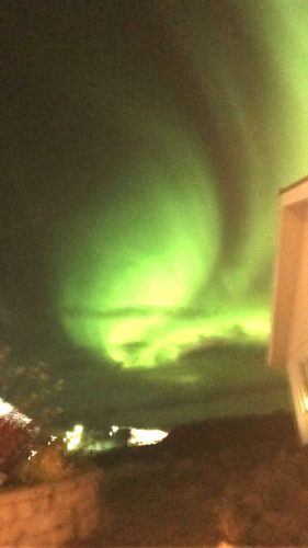 northern lights over the northern lights inn iceland