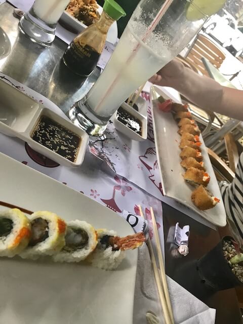 sushi on white plates and drink at kabuki-medellin
