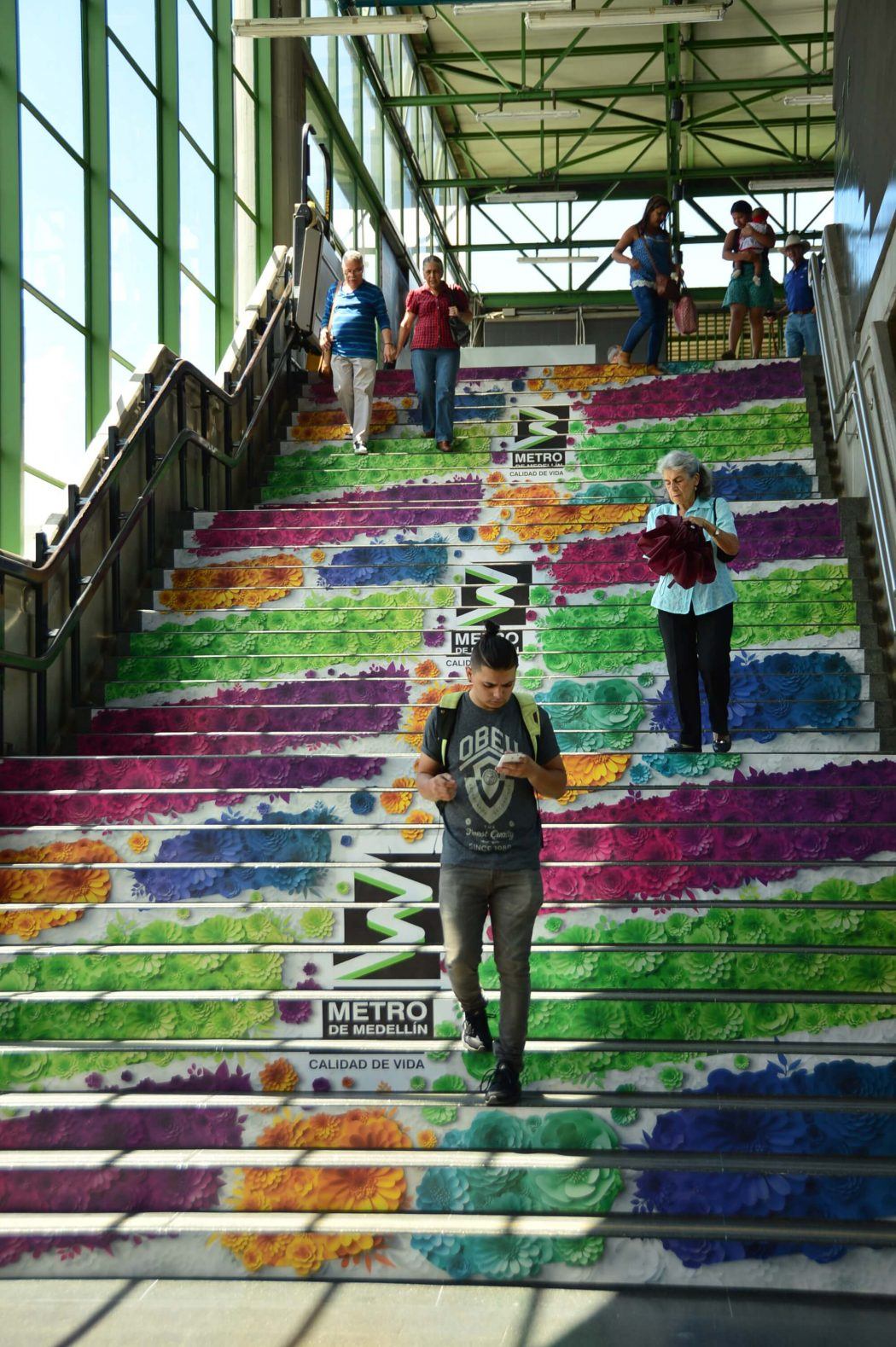 steps of medellin metro decorate with floral images