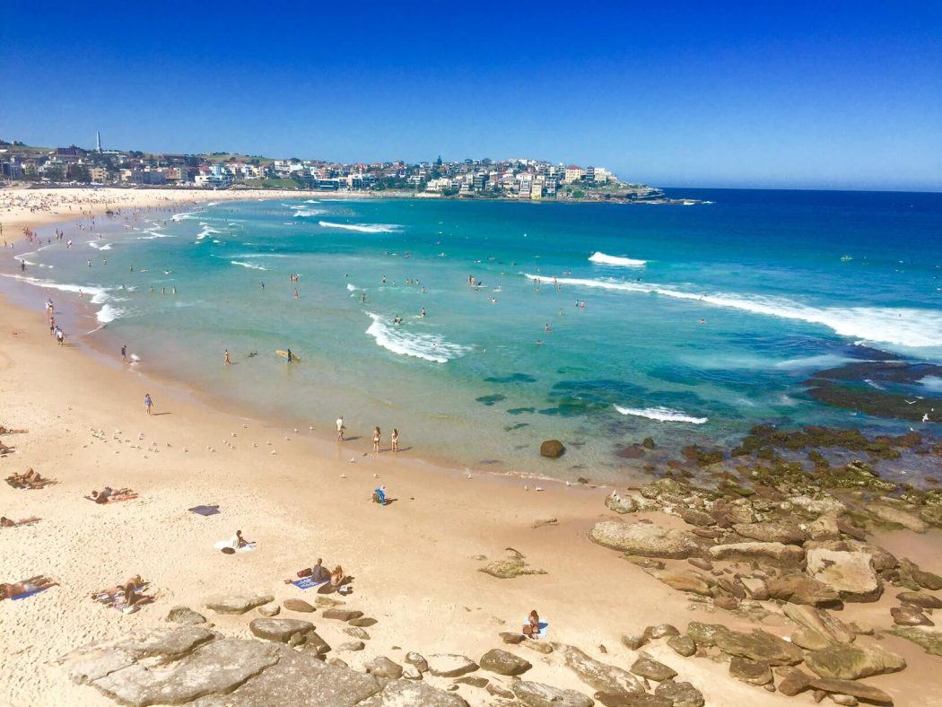 10 Best Weekend Getaways From Sydney for Boutique Hotel Lovers 24 an overview of an australian beach with golden sands and blue water