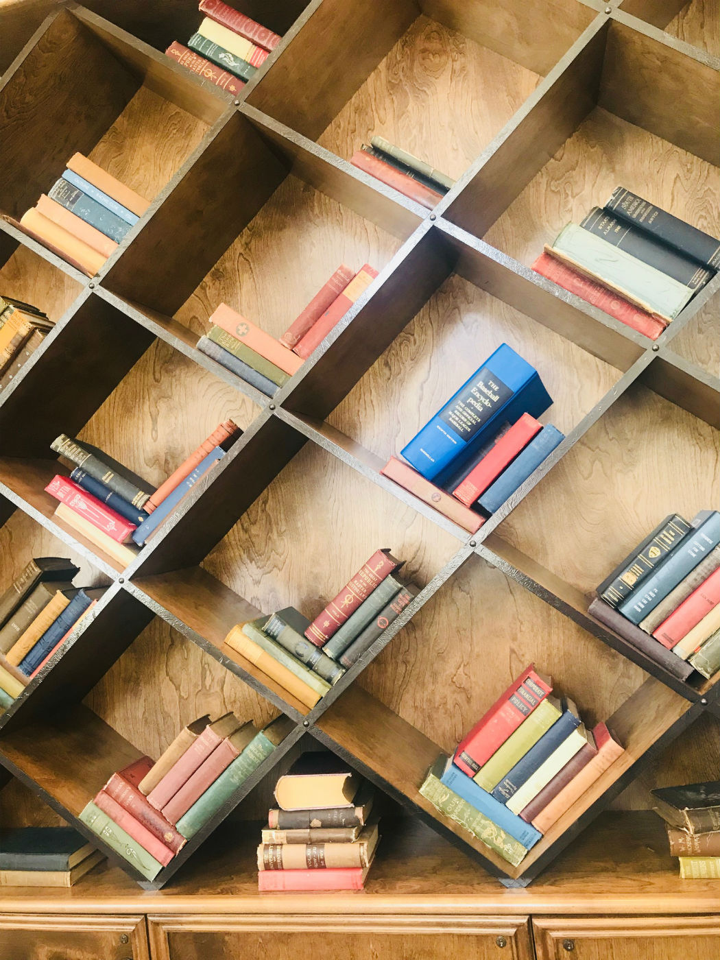 slanted bookshelf with gaps