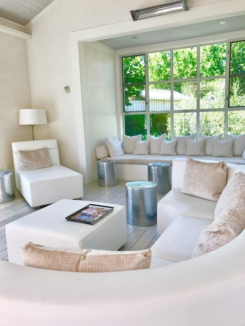 white couches in the entry area of the solage spa