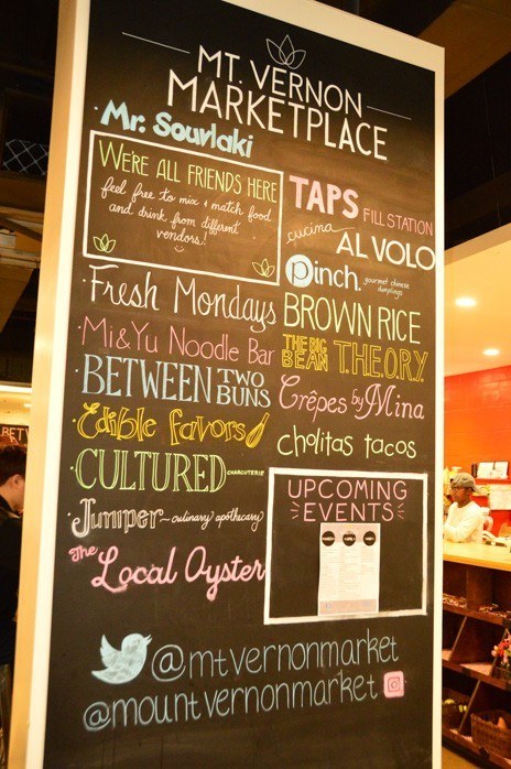 5 Great Baltimore Food Tour Options: Guided and DIY 4 chalk board with food options at Mt Vernon marketplace