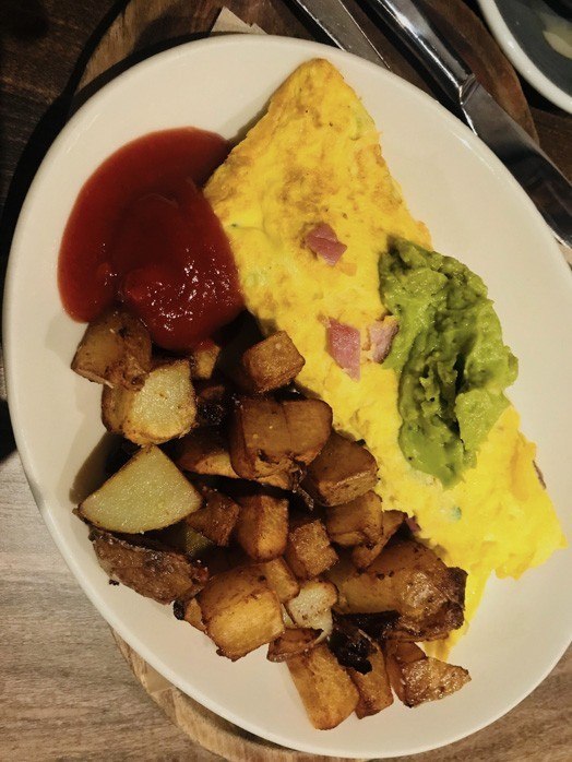 omelette with guacamole and diced potatoes at Dooby's Baltimore
