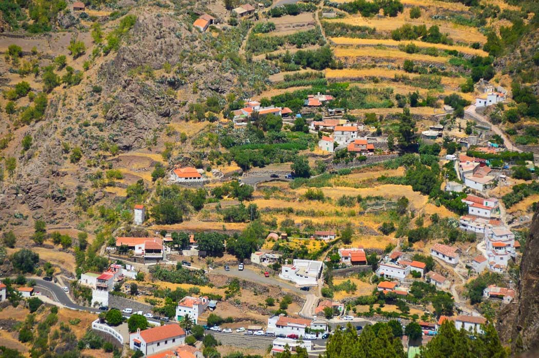 small houses with coral roofs on a hill in gran canaria