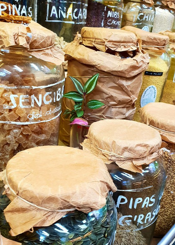 7 Best Gran Canaria Markets You Won't Want to Miss 19 Glass jars with seeds and nuts inside on display at a market