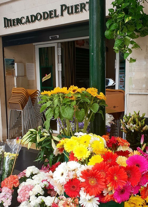 7 Best Gran Canaria Markets You Won't Want to Miss 1 entrance with flowers at mercade del puerto las palmas