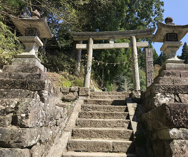 stone stairs lead up to a smal temple