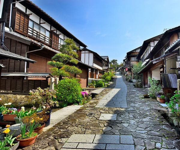 Nakasendo Trail and What to Expect at a Japanese Ryokan 3 path and houses in a japanese village on the Nakasendo Trail