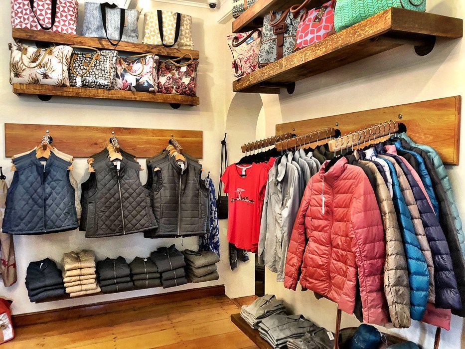 puffer vests and jackets merchandised at the shop at kwandwe south africa