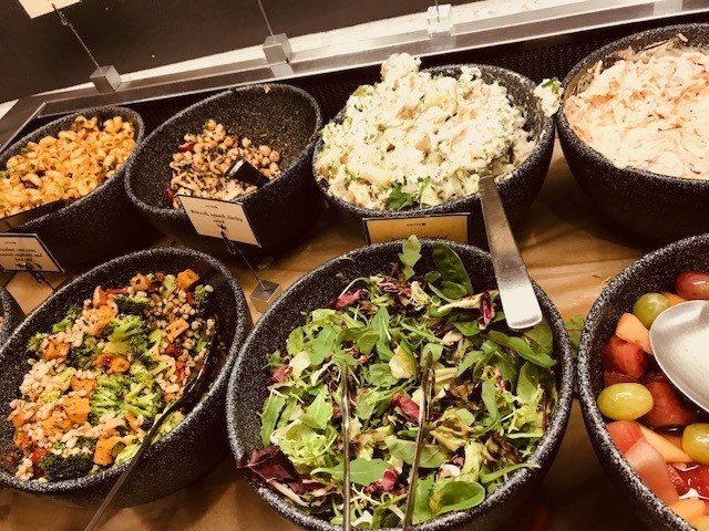 different salads on display in united airlines lounge heathrow terminal 2