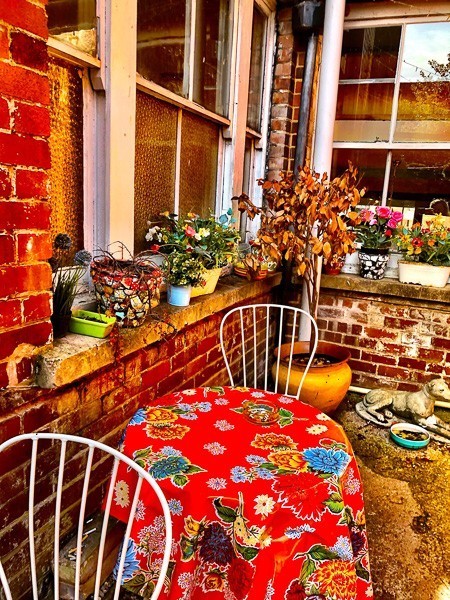 6 Cafes in Exeter Not to Miss 5 colourful outdoor seating area at Glorious Art House Coffee House Exeter