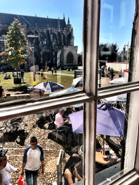 6 Cafes in Exeter Not to Miss 13 view of exeter cathedral looking out the window of Tea on the Green Cafe