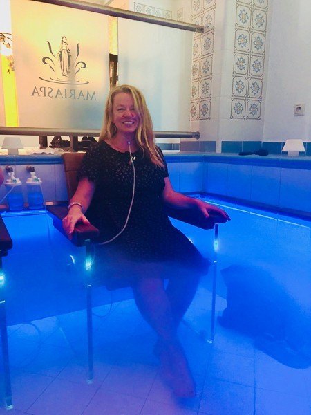 woman sits in marianske lazne carbon pool