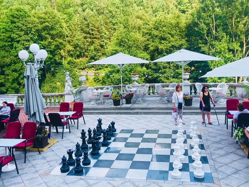 3 Best Czech Republic Spa Towns in Bohemia 40 hotel radon jachymov outdoor large chess set and umbrellas