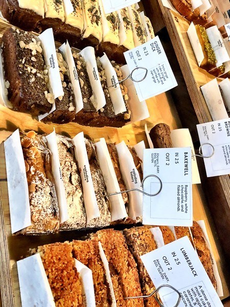 6 Cafes in Exeter Not to Miss 10 The Exploding Bakery tray bake Cakes on display