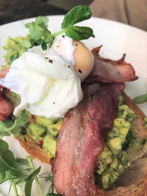 eggs and bacon and avocado on toast at Lassco