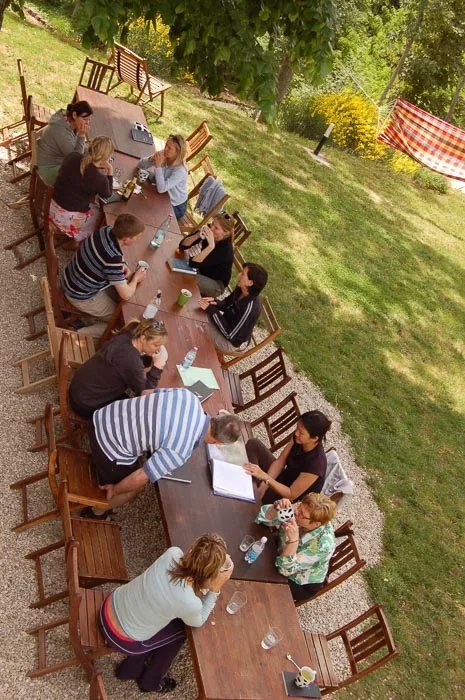 large group of people at a communal table