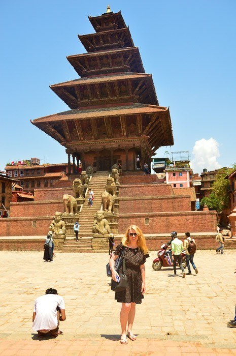 31 Fantastic Singles Travel Groups (2022) 5 woman poses in front of a temple in bhaktapur nepal
