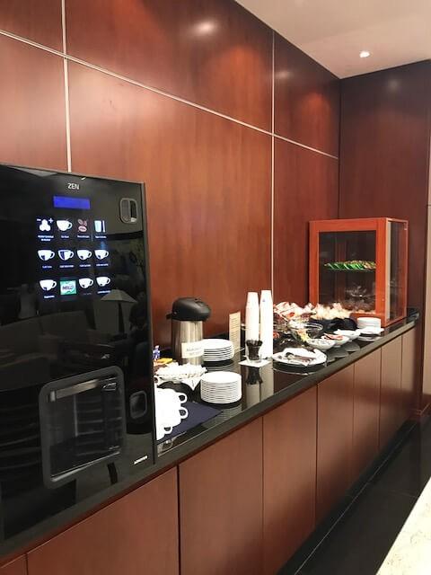 Iberia Business Class Review: Is it Worth It? 7 lounge at medellin airport for iberia business class with coffee and tea station