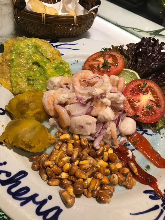 plate with ceviche and avocado and tomatoes