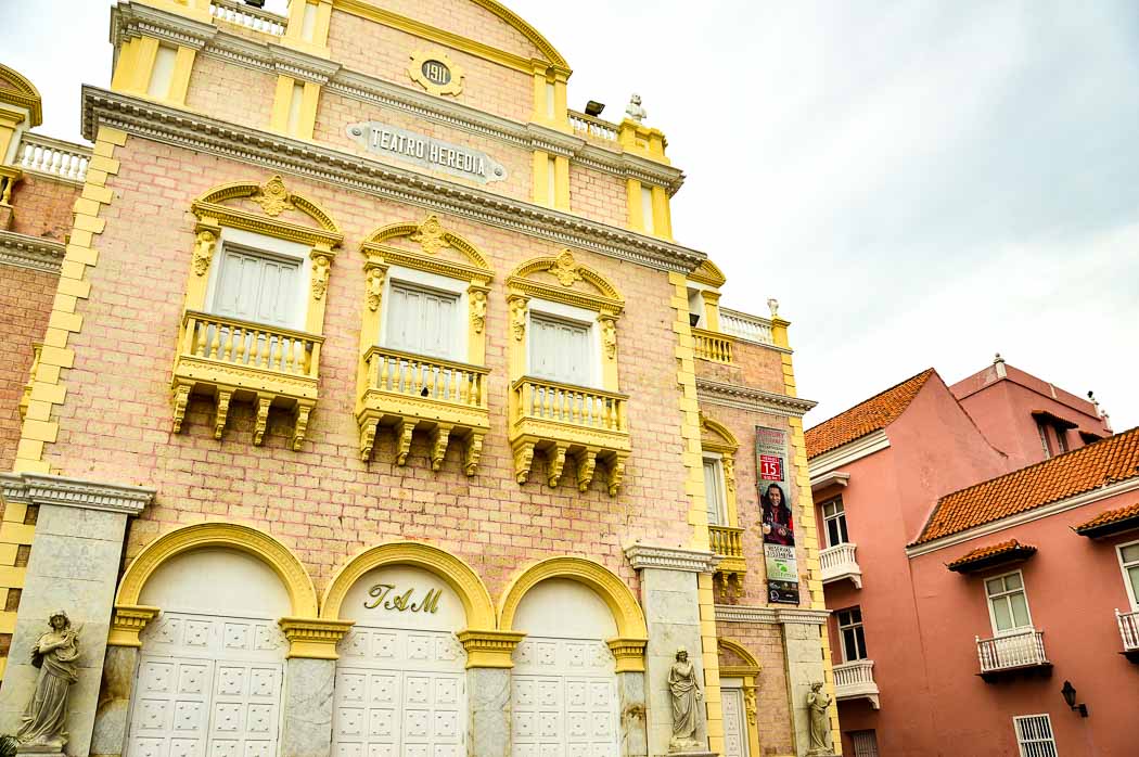 Perfect Colombia Itinerary 2 Weeks including the Rainbow River 26 pink building with yellow trim in Cartagena