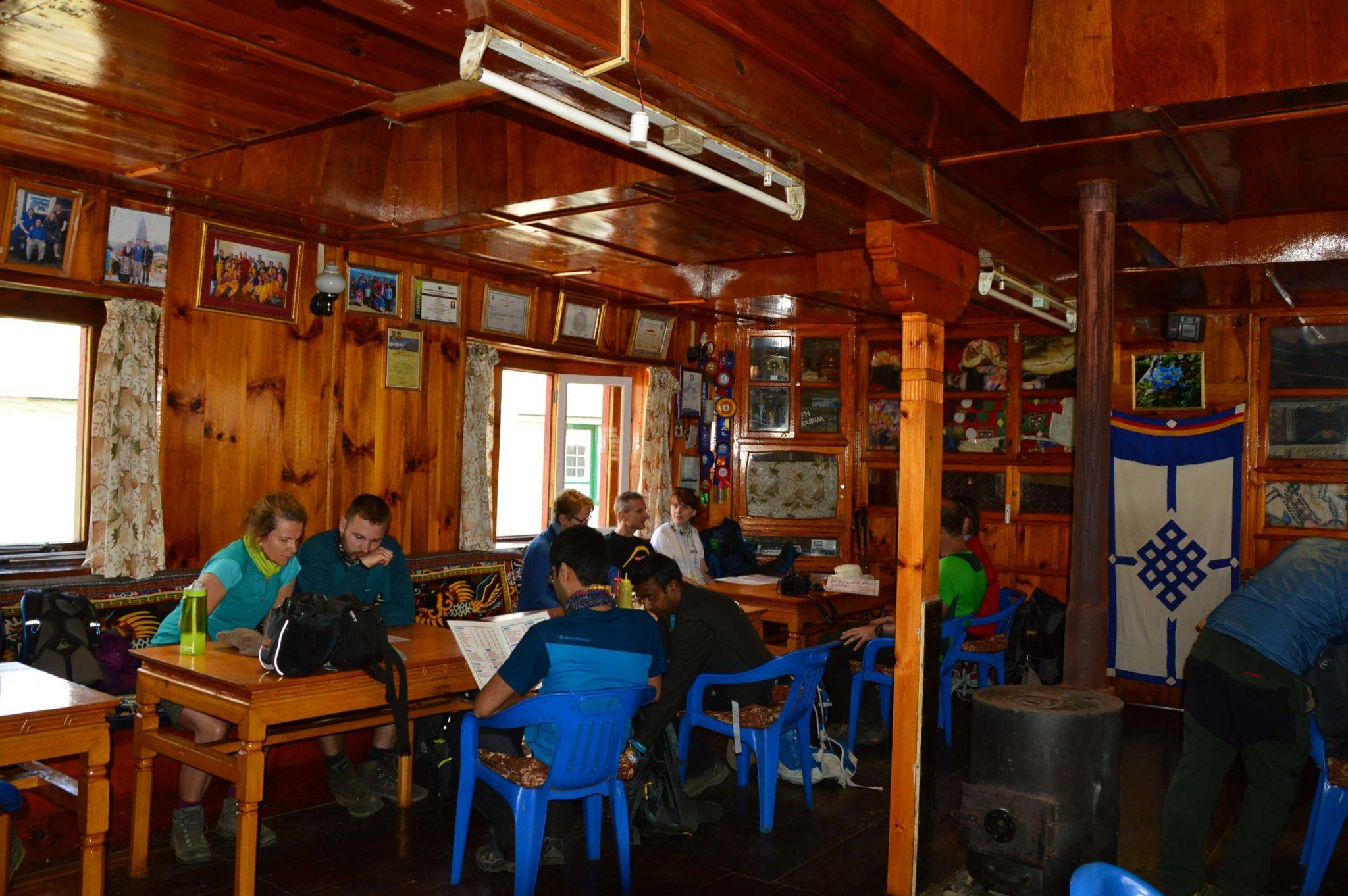 a typical tea house in nepal communal area with people at tables